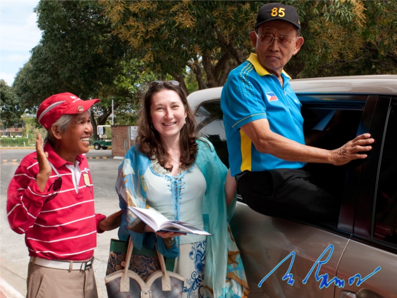 President Ramos posing at his car window for picture with Natalya